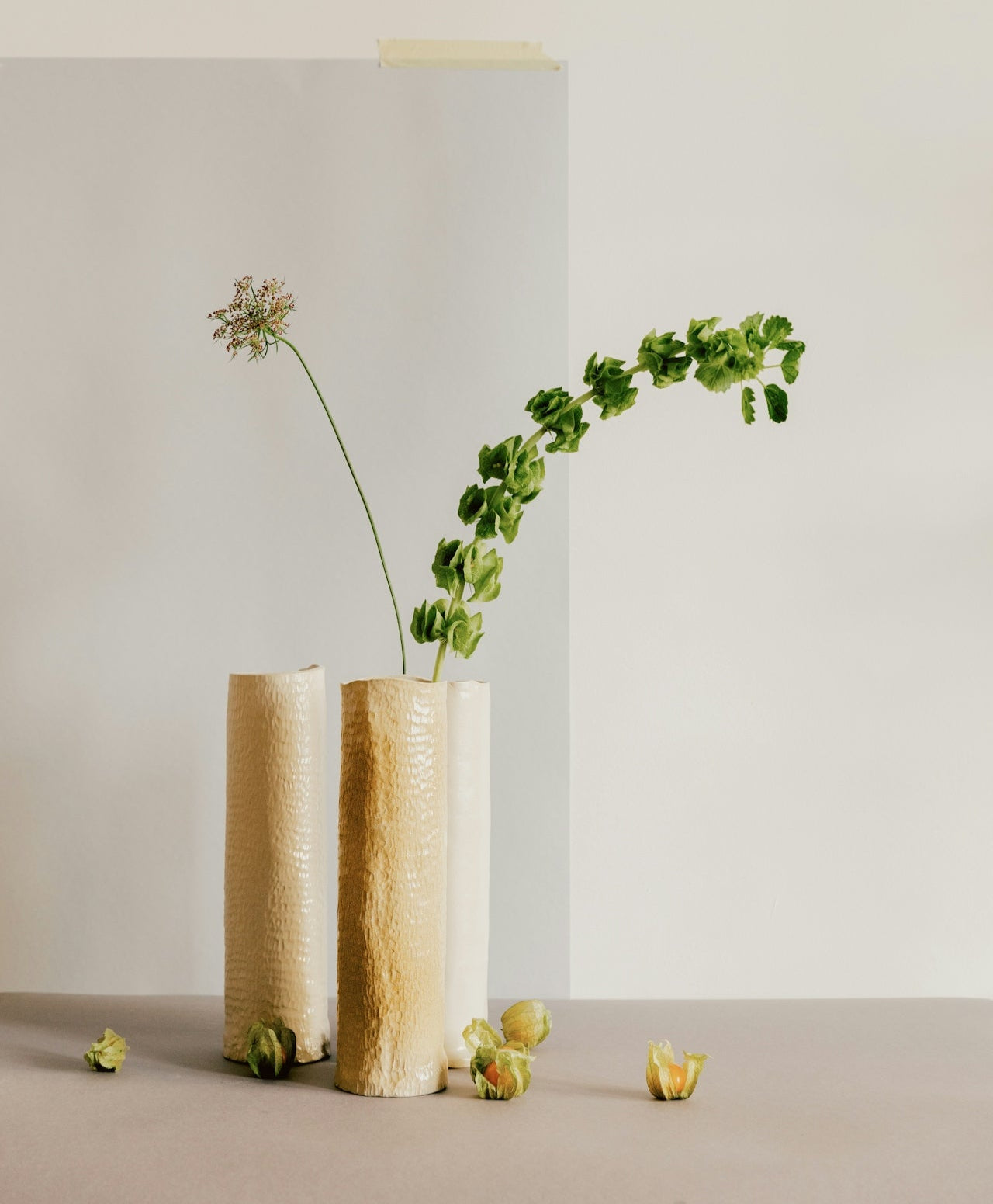 Minimalist vase with flower stems representing the perfect finishing touch for a space